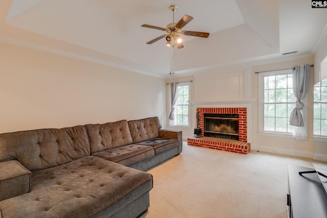 311 Hillridge Way, Columbia, SC 29229 - carpeted living area with a ceiling fan, a fireplace, ornamental molding, and a raised ceiling