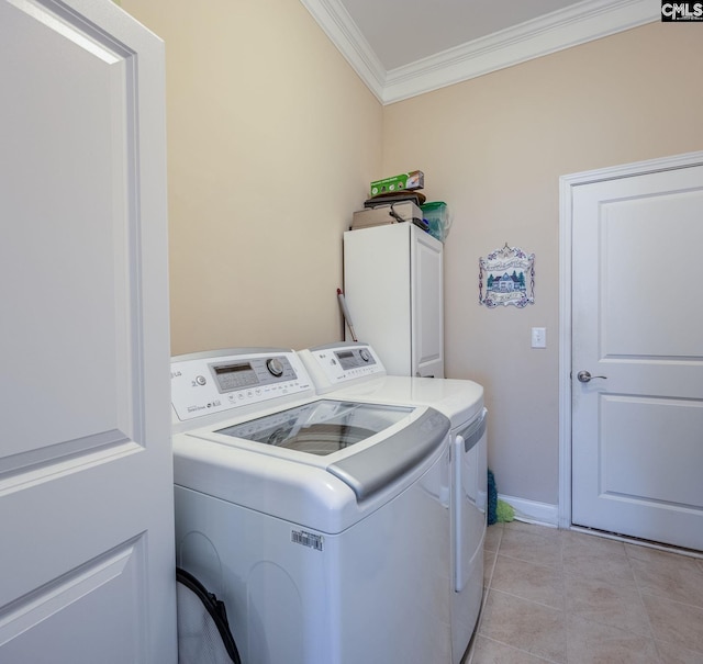 605 Scarlet Baby Dr, Blythewood, SC 29016 - laundry area with ornamental molding, washing machine and dryer, cabinet space, light tile patterned flooring, and baseboards