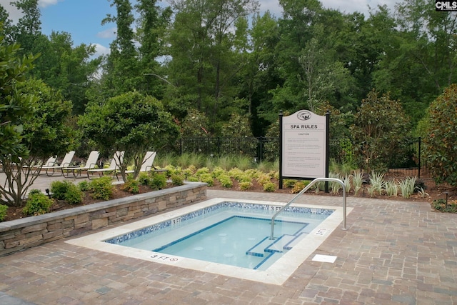 605 Scarlet Baby Dr, Blythewood, SC 29016 - view of pool featuring a community hot tub, a pool, and view of wooded area