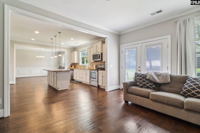546 Caladium Way, Columbia, SC 29229 - living area featuring ornamental molding, dark wood-style flooring, a chandelier, french doors, and recessed lighting