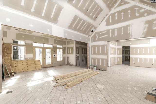 88C Tombfield Rd, Camden, SC 29020 - unfurnished living room with high vaulted ceiling, french doors, and hardwood / wood-style floors