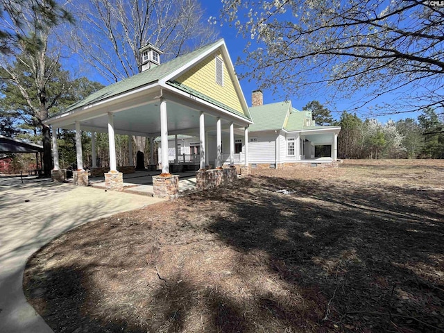 88C Tombfield Rd, Camden, SC 29020 - view of front facade with a porch, a chimney, a gazebo, and a carport