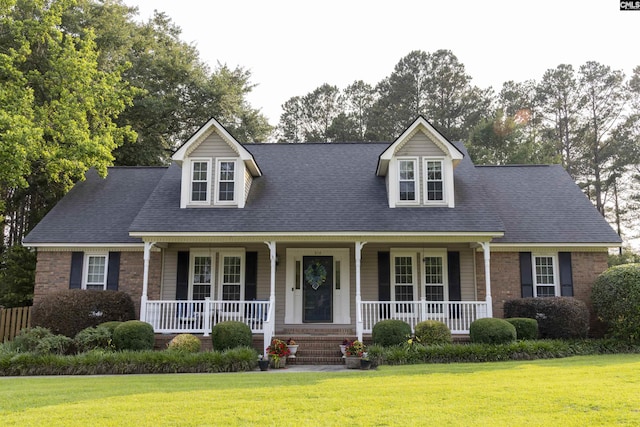 213 River Xing, Lexington, SC 29072 - cape cod home with a porch, brick siding, a front yard, and a shingled roof