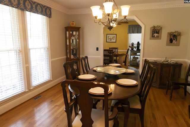 213 River Xing, Lexington, SC 29072 - dining room featuring a chandelier, light wood-style flooring, crown molding, and baseboards