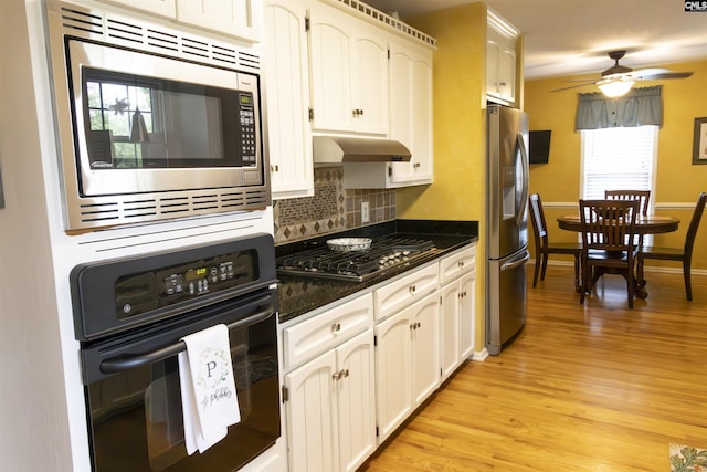 213 River Xing, Lexington, SC 29072 - kitchen featuring appliances with stainless steel finishes, range hood, light wood-style floors, a ceiling fan, and decorative backsplash