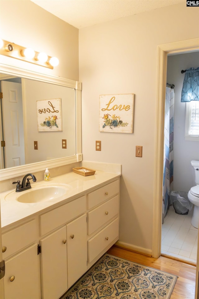 213 River Xing, Lexington, SC 29072 - bathroom featuring vanity, toilet, and wood finished floors
