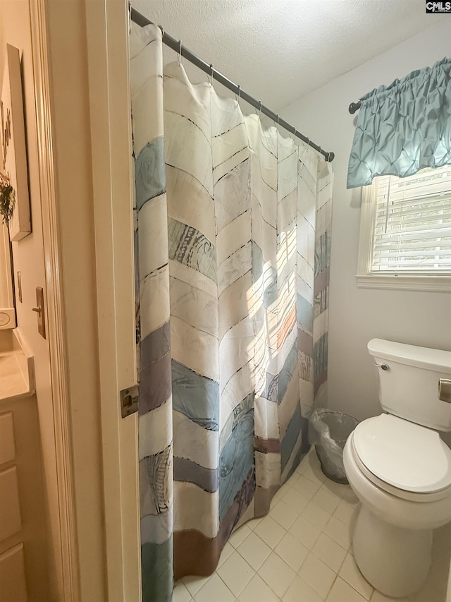 213 River Xing, Lexington, SC 29072 - bathroom featuring toilet, a textured ceiling, tile patterned floors, and a shower with shower curtain