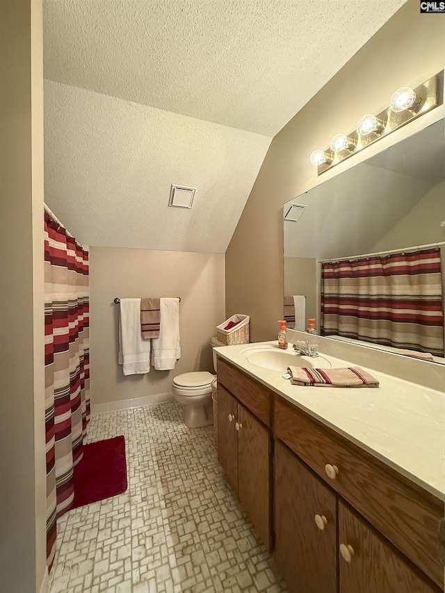 213 River Xing, Lexington, SC 29072 - bathroom with vaulted ceiling, a textured ceiling, vanity, toilet, and baseboards
