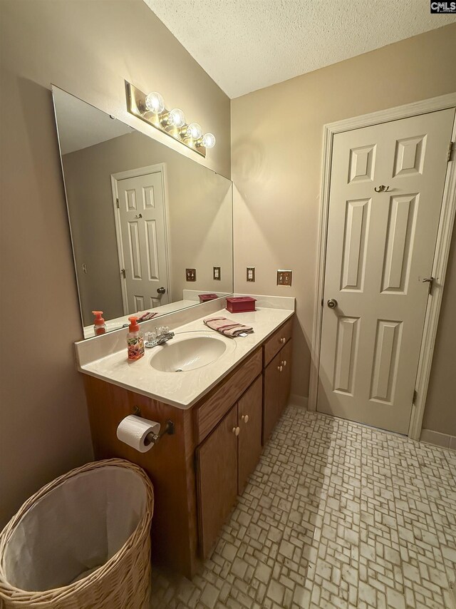 213 River Xing, Lexington, SC 29072 - bathroom featuring vanity, a textured ceiling, and baseboards
