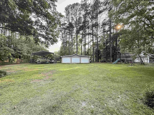 213 River Xing, Lexington, SC 29072 - view of yard with a garage, a playground, an outdoor structure, a carport, and view of scattered trees