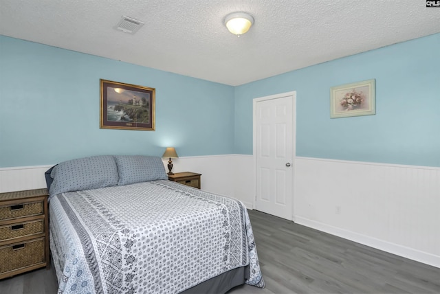 112 S Wrenwood Dr, Lexington, SC 29073 - bedroom with wood finished floors, a wainscoted wall, and a textured ceiling