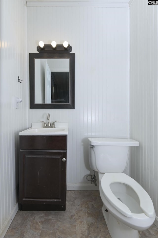 112 S Wrenwood Dr, Lexington, SC 29073 - bathroom with toilet, vanity, baseboards, and wood walls