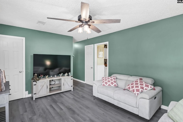 112 S Wrenwood Dr, Lexington, SC 29073 - living room with ceiling fan, dark wood-type flooring, baseboards, and a textured ceiling