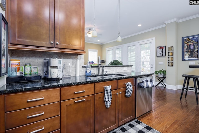 237 Peninsula Way, Columbia, SC 29229 - kitchen featuring dishwasher, dark wood finished floors, crown molding, decorative backsplash, and dark stone counters