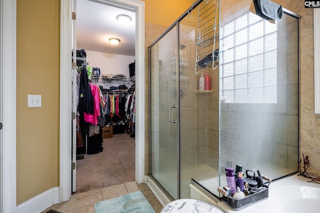 237 Peninsula Way, Columbia, SC 29229 - full bath with a stall shower, a spacious closet, tile patterned flooring, and a garden tub