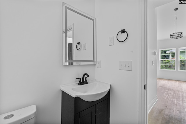 3723 Hoyt St, Columbia, SC 29223 - bathroom with vanity, toilet, wood finished floors, and baseboards