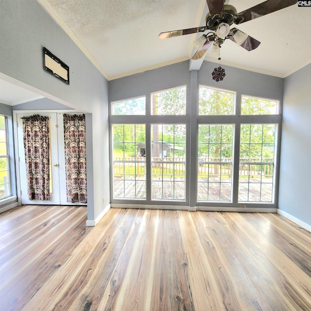 137 Breezy Bay Cir, Gilbert, SC 29054 - unfurnished living room with lofted ceiling, healthy amount of natural light, baseboards, wood finished floors, and crown molding