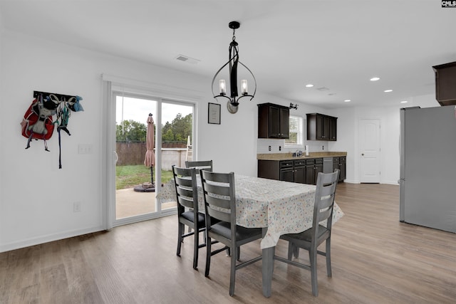 73 Mayapple Dr, Lexington, SC 29073 - dining room featuring a chandelier, light wood finished floors, recessed lighting, and healthy amount of natural light