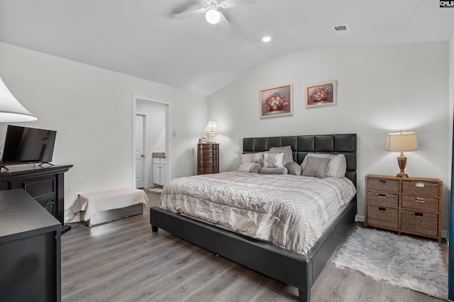 254 Sundew Rd, Elgin, SC 29045 - bedroom featuring vaulted ceiling, wood finished floors, a ceiling fan, and ensuite bath