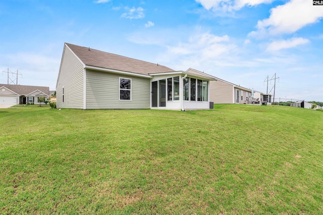 254 Sundew Rd, Elgin, SC 29045 - back of property featuring a sunroom and a lawn