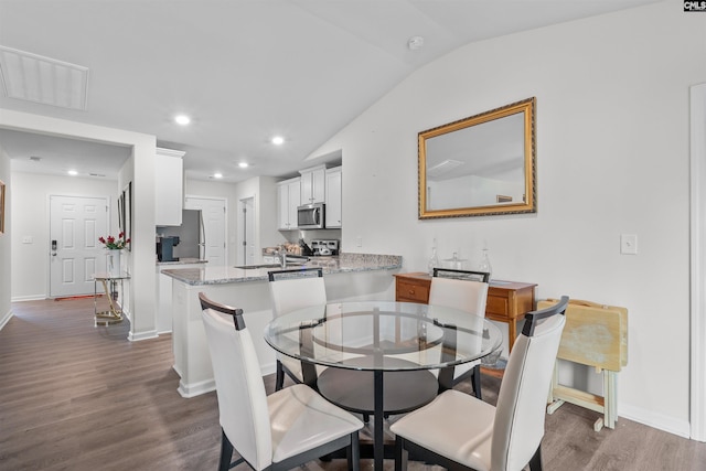 254 Sundew Rd, Elgin, SC 29045 - dining space with vaulted ceiling, dark wood finished floors, baseboards, and recessed lighting