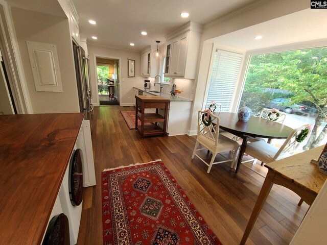 2003 Springdale Dr, Camden, SC 29020 - dining area featuring ornamental molding, dark wood-style floors, recessed lighting, baseboards, and electric panel