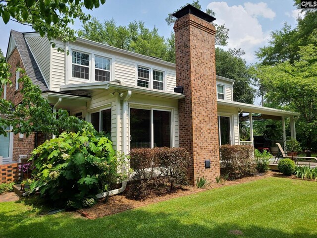 2003 Springdale Dr, Camden, SC 29020 - rear view of property featuring a yard and a chimney