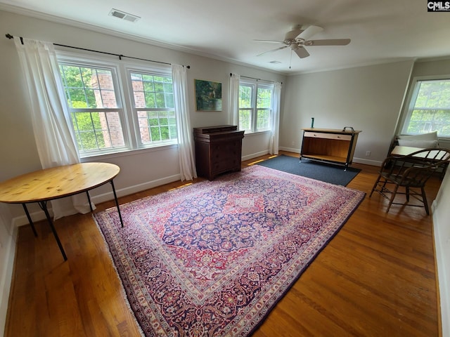 2003 Springdale Dr, Camden, SC 29020 - living area with plenty of natural light, wood finished floors, crown molding, a ceiling fan, and baseboards