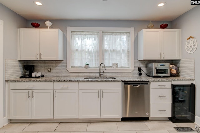 4524 Mosshill Rd, Columbia, SC 29206 - kitchen featuring dishwasher, a sink, wine cooler, backsplash, and light stone counters