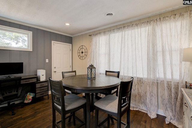 4524 Mosshill Rd, Columbia, SC 29206 - dining space featuring crown molding and dark wood-style flooring
