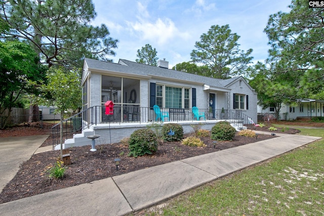4524 Mosshill Rd, Columbia, SC 29206 - view of front of property featuring a sunroom, brick siding, and a chimney