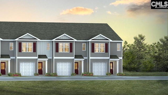 11A Beechnut St, Lugoff, SC 29078 - view of front facade featuring board and batten siding, a yard, an attached garage, and roof with shingles