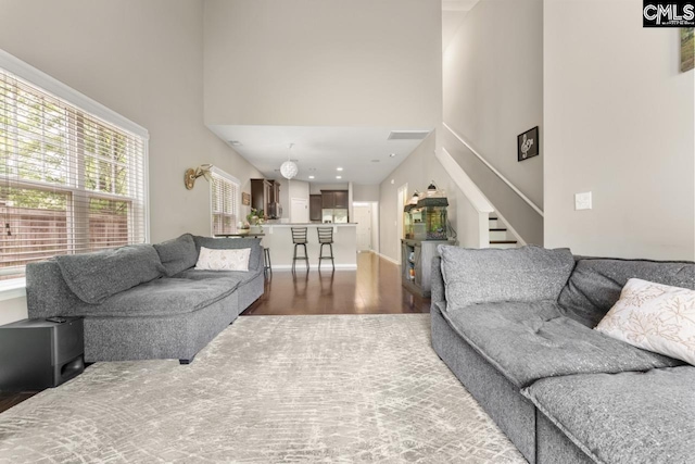 300 Brookland Way W, Columbia, SC 29169 - living area with a towering ceiling, stairway, and dark wood-style floors