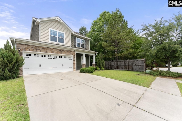 300 Brookland Way W, Columbia, SC 29169 - view of front of home with driveway, stone siding, and a garage