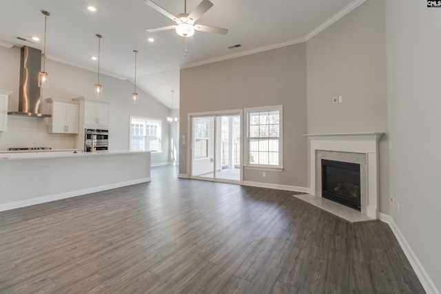 2752 Pawtucket Way, Chapin, SC 29036 - unfurnished living room featuring a ceiling fan, a premium fireplace, ornamental molding, dark wood-style flooring, and baseboards