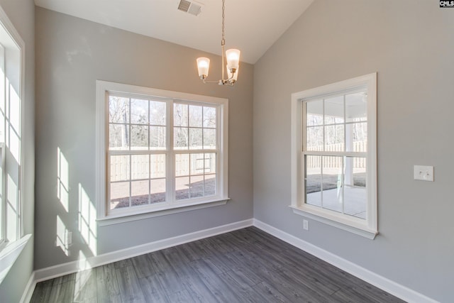 2752 Pawtucket Way, Chapin, SC 29036 - unfurnished dining area with a chandelier, vaulted ceiling, dark wood-style floors, and baseboards