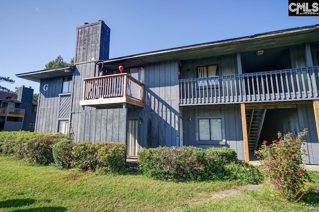 1211 Metze Rd Unit G2, Columbia, SC 29210 - back of house with a chimney and a balcony