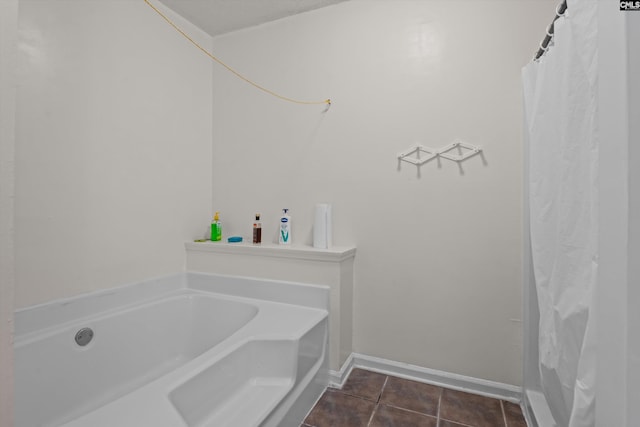 4 Pitsford Ct, Irmo, SC 29063 - bathroom with a garden tub, tile patterned flooring, and baseboards