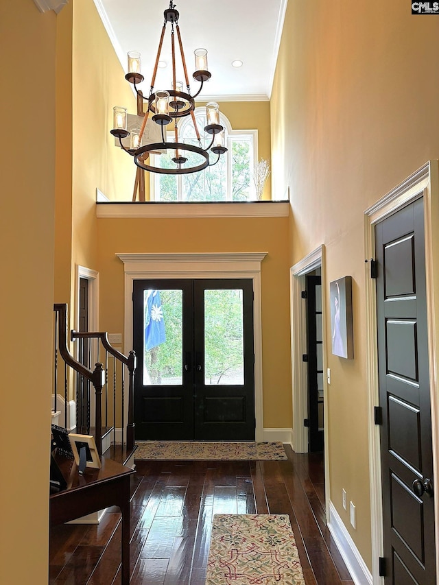 166 Sawney Creek Cir, Ridgeway, SC 29130 - foyer with healthy amount of natural light, a chandelier, hardwood / wood-style flooring, ornamental molding, and a towering ceiling