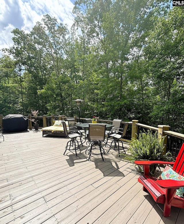 166 Sawney Creek Cir, Ridgeway, SC 29130 - deck with outdoor dining area and view of scattered trees