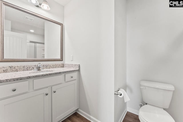 337 Gum Swamp Trl, West Columbia, SC 29169 - bathroom featuring toilet, vanity, baseboards, and wood finished floors