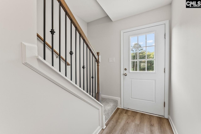 339 Gum Swamp Trl, West Columbia, SC 29169 - doorway to outside featuring wood finished floors, baseboards, and stairway