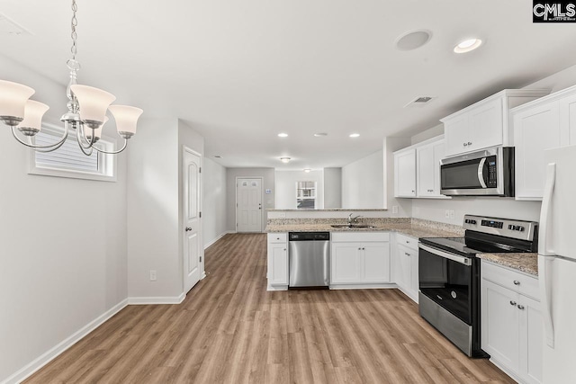 339 Gum Swamp Trl, West Columbia, SC 29169 - kitchen featuring stainless steel appliances, a sink, light wood-style flooring, baseboards, and recessed lighting