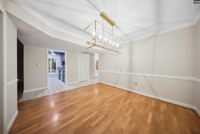 137 Shannondale Ct, Columbia, SC 29209 - unfurnished dining area with light wood-style flooring, a textured ceiling, stairs, a chandelier, and baseboards