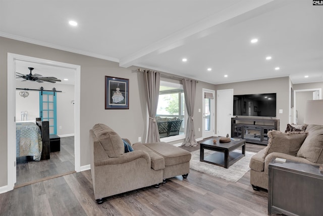 1620 Deep Cove Ln, Gilbert, SC 29054 - living area with a barn door, wood finished floors, crown molding, baseboards, and recessed lighting