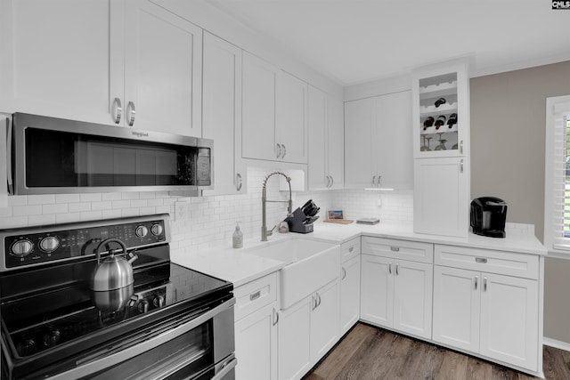 1620 Deep Cove Ln, Gilbert, SC 29054 - kitchen featuring stainless steel appliances, a sink, tasteful backsplash, and white cabinetry