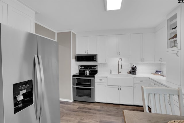 1620 Deep Cove Ln, Gilbert, SC 29054 - kitchen with appliances with stainless steel finishes, a sink, wood finished floors, and white cabinetry