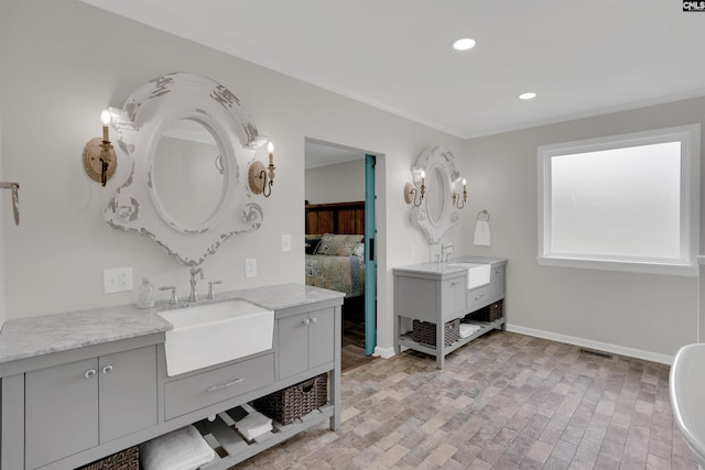 1620 Deep Cove Ln, Gilbert, SC 29054 - full bath featuring two vanities, ensuite bath, baseboards, recessed lighting, and crown molding