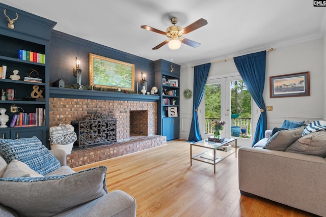 22 Mallet Hill Ct, Columbia, SC 29223 - living room with crown molding, a ceiling fan, wood finished floors, a fireplace, and built in shelves