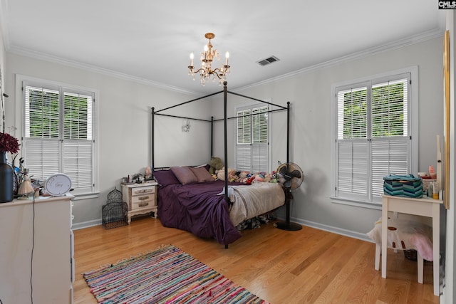 22 Mallet Hill Ct, Columbia, SC 29223 - bedroom with a chandelier, light wood-type flooring, crown molding, and baseboards